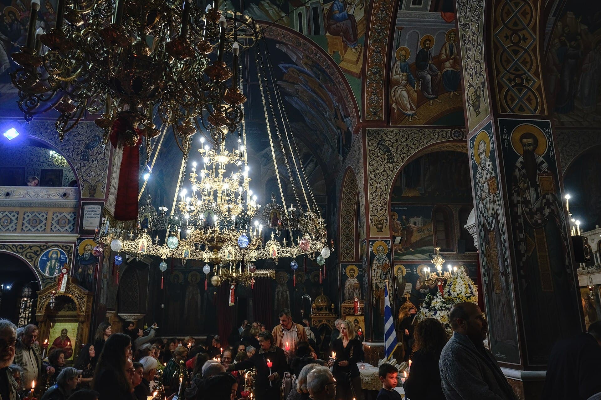 A packed church with candles at the Easter service