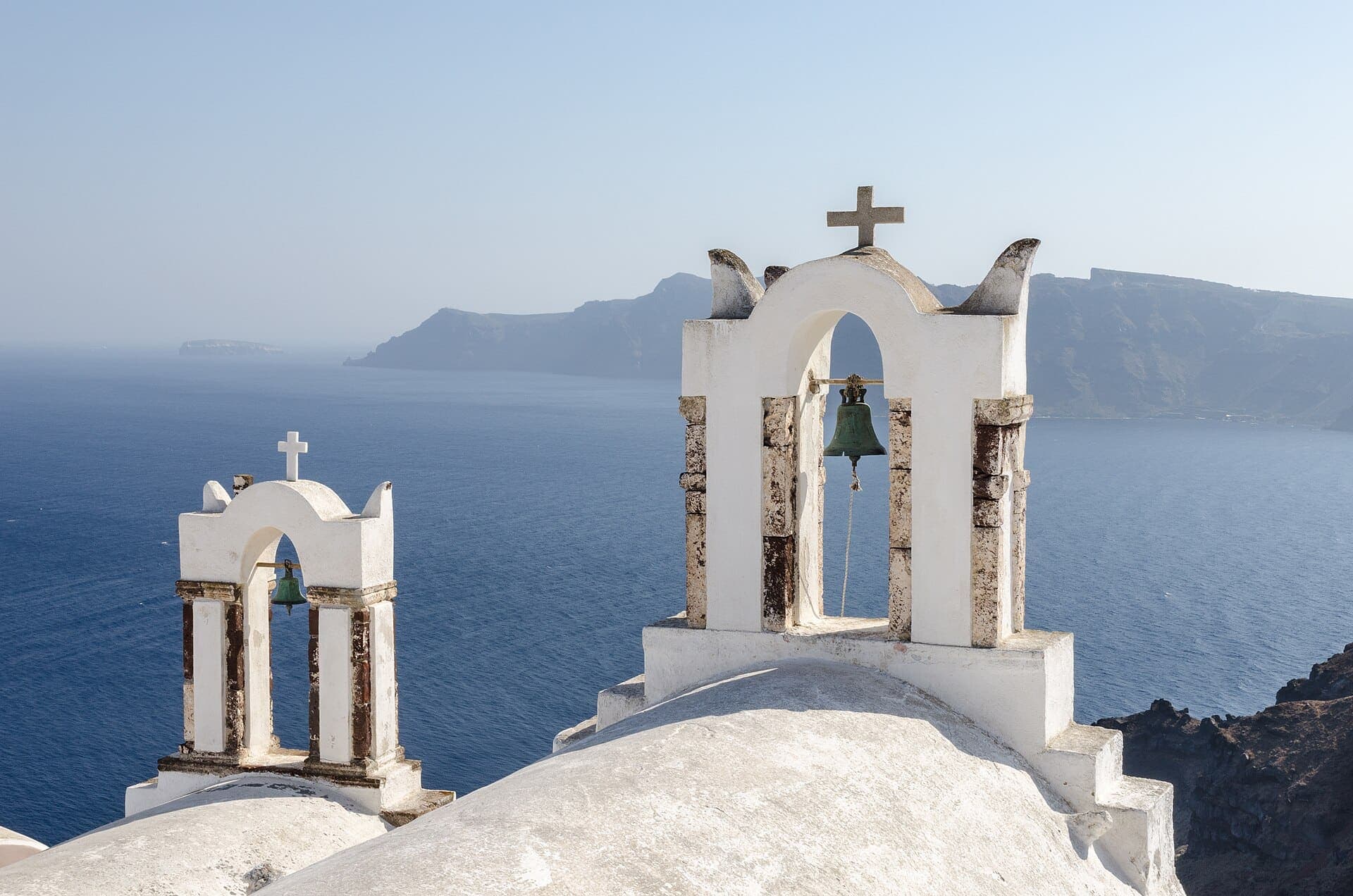Blue-domed church and bell towers in Oia, Santorini