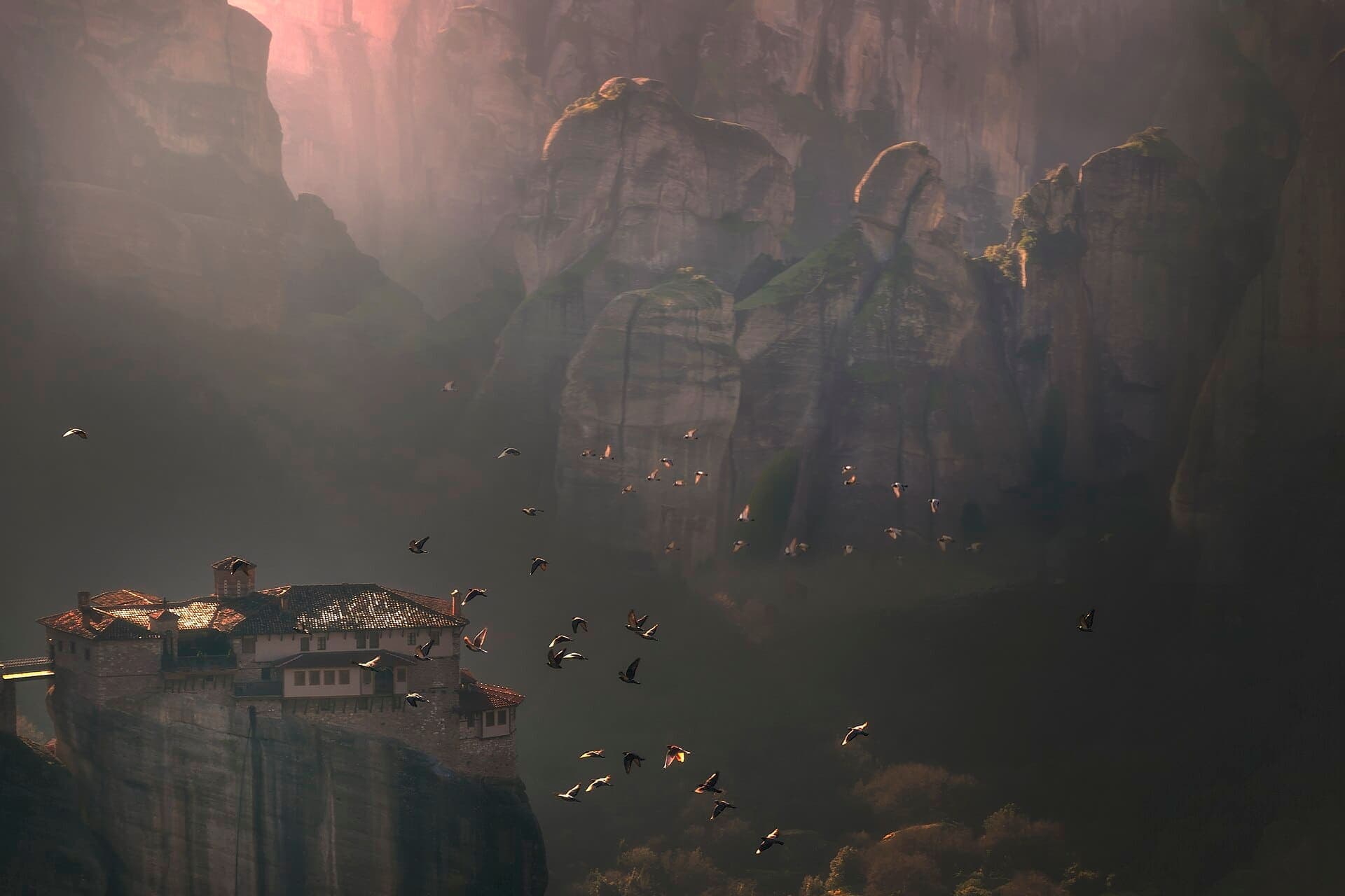 A monastery of Meteora on its rock at dusk