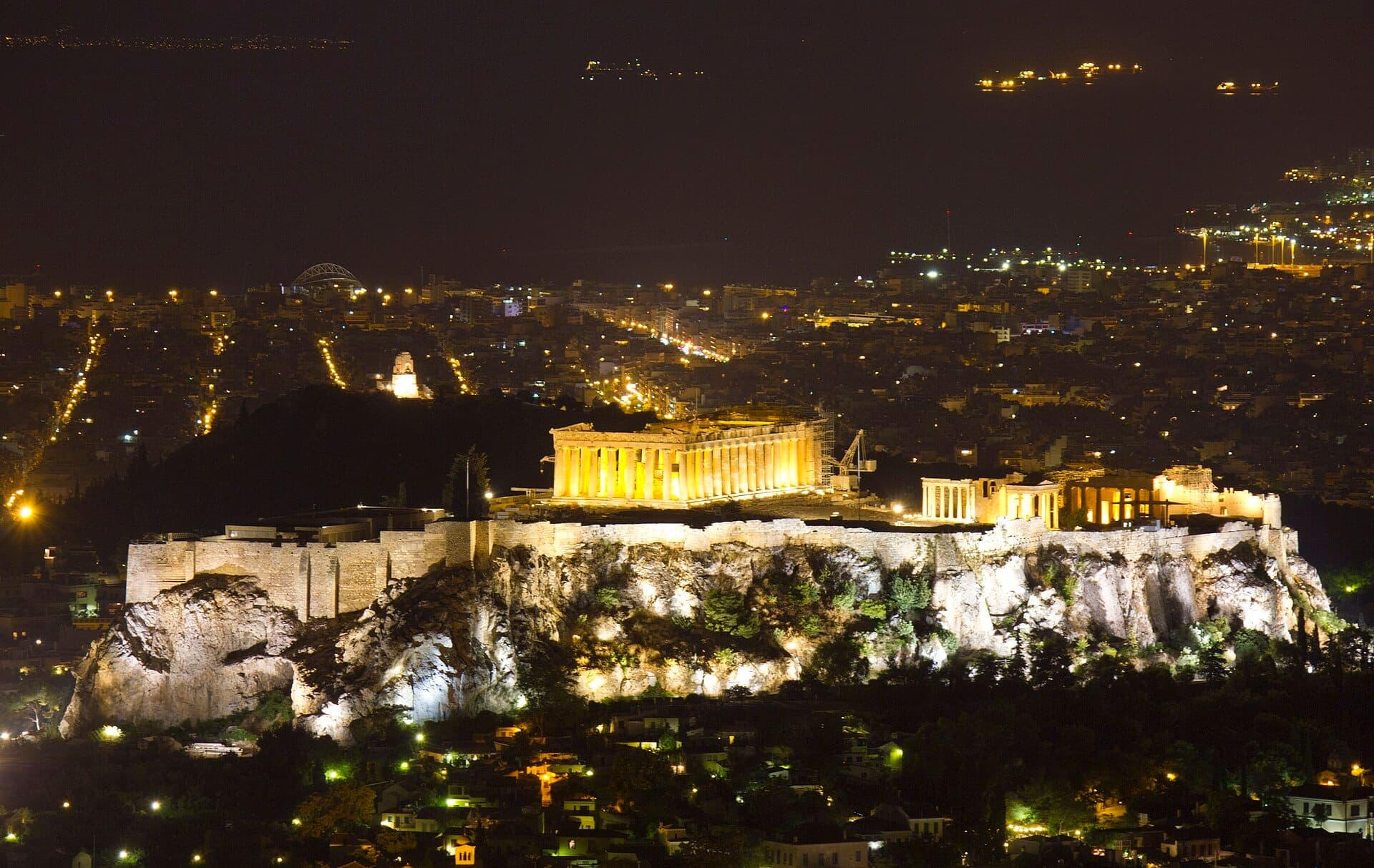 The illuminated Acropolis at night, seen from Lycabettus
