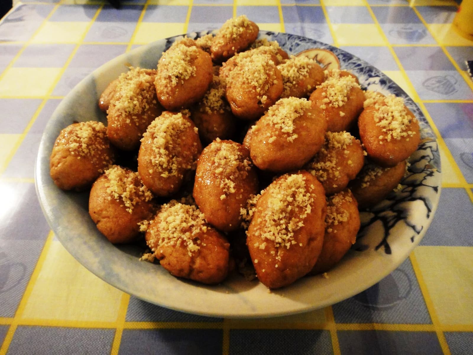 A plate of melomakarona, honey-soaked Christmas cookies
