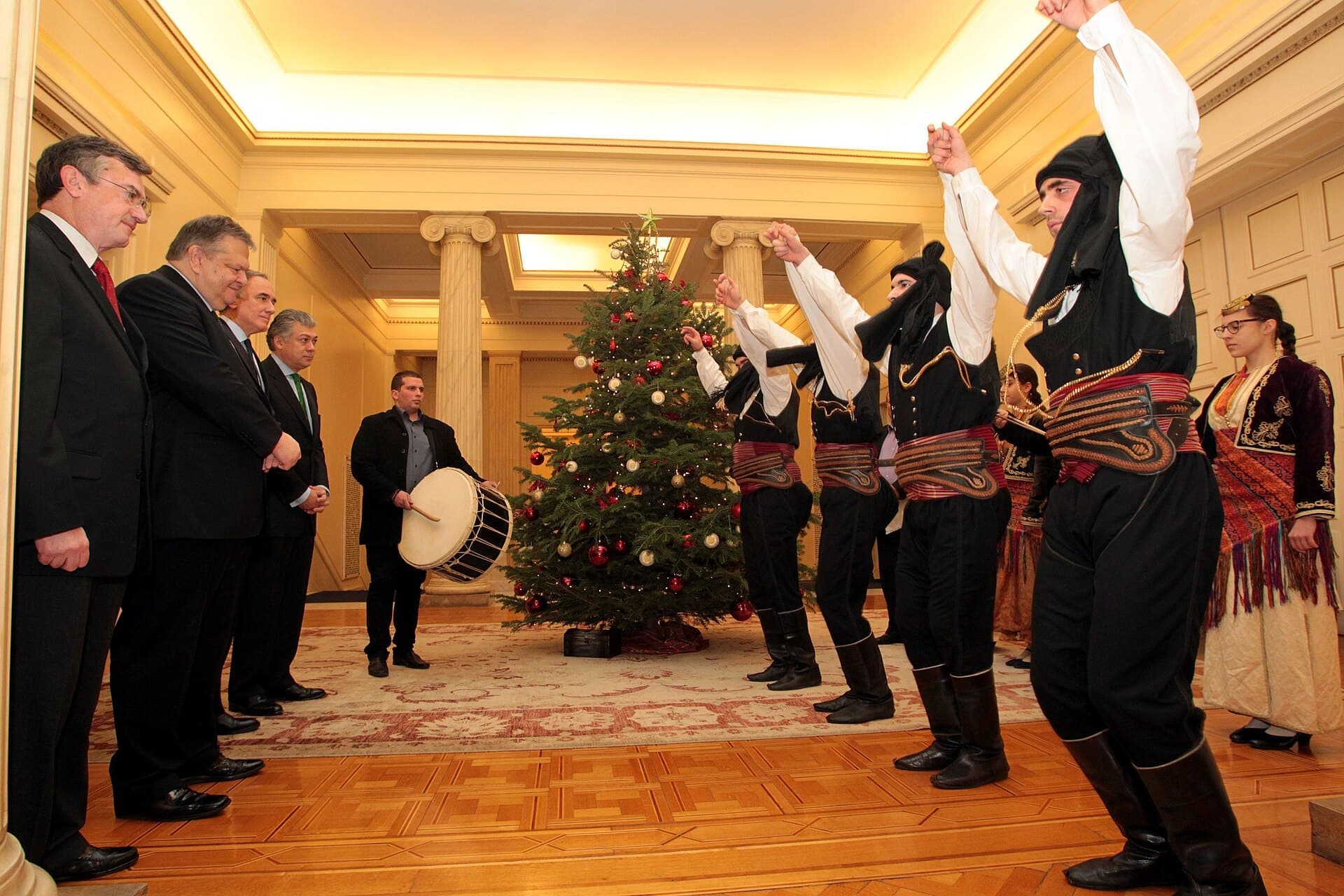 Carol singers in traditional dress on Christmas Eve