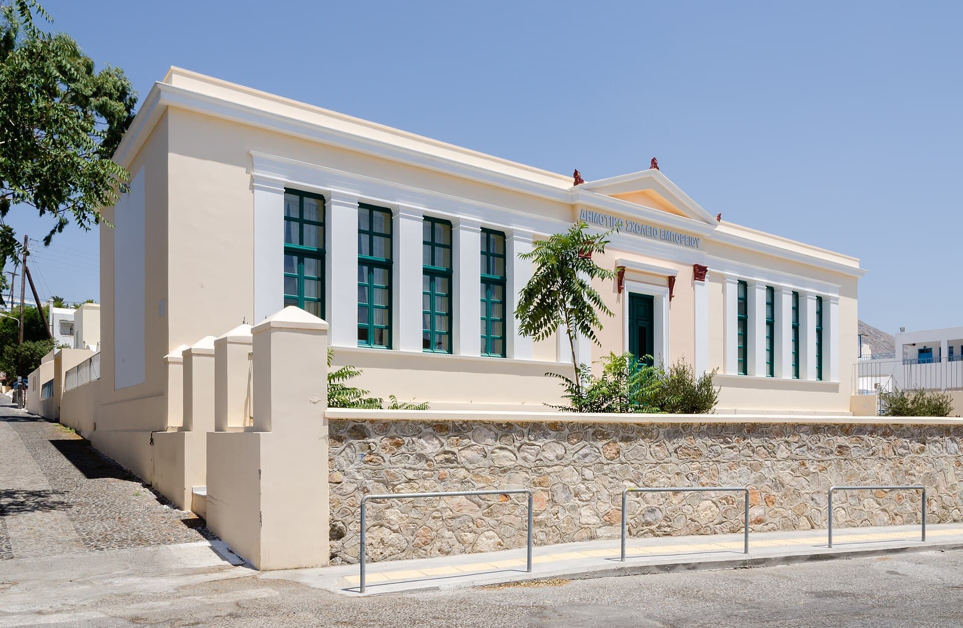 A neoclassical school building in a Greek village